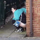 A security camera records a plump, mature woman trying to discreetly shit in an alleyway. To her horror, a bicyclist passes nearby, but he does not seem to notice. Funny public exposure clip. Presented in 720P HD. Over half a minute.